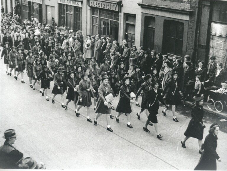Hillhall Girl Guides parading in Castle St on V.E. Day