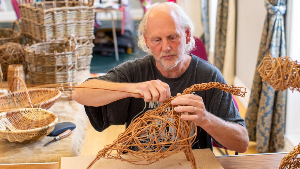 Clive Lyttle from Welig Heritage Crafts demonstrating willow weaving in Ards Arts Centre